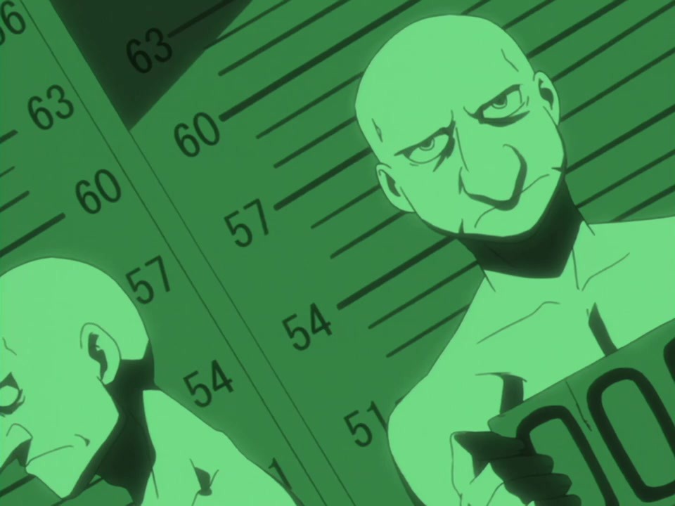 A screencap of the 2003 anime. Bido, shirtless, stands under green lighting for a mugshot. Why are his pecs so defined'